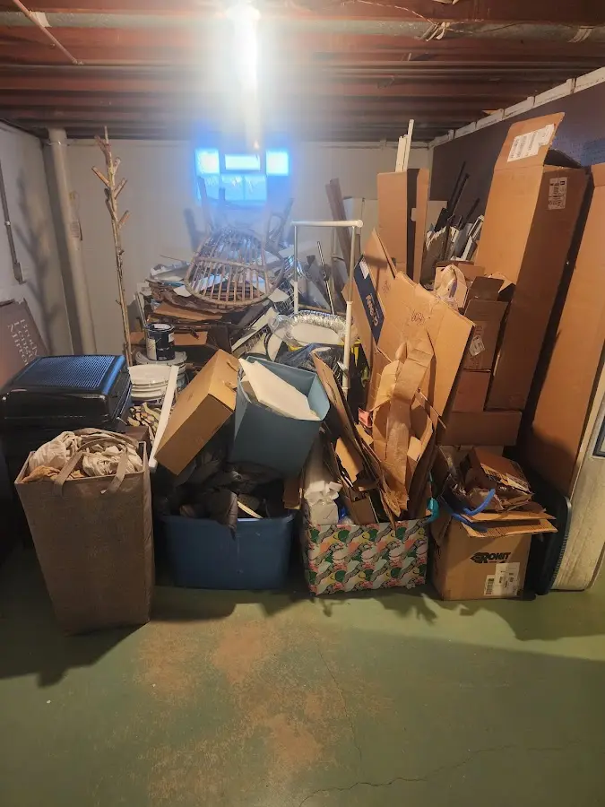 Roll-off dumpster container at job site for Yard Waste Dumpster Rental in Harlan